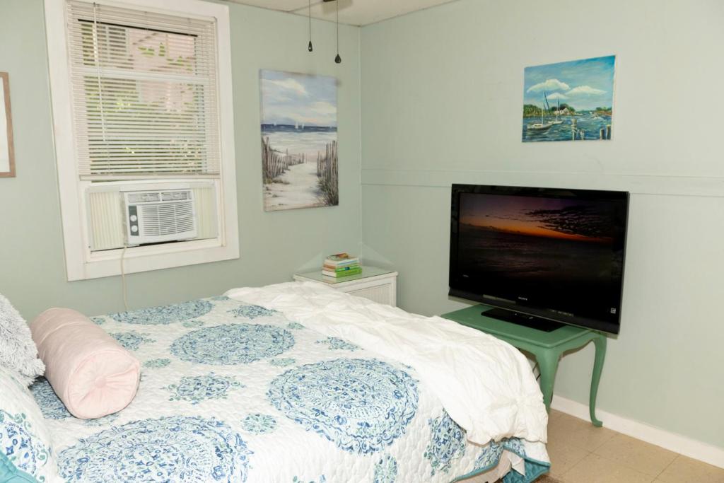 TV a/nebo společenská místnost v ubytování Pink Paradise
