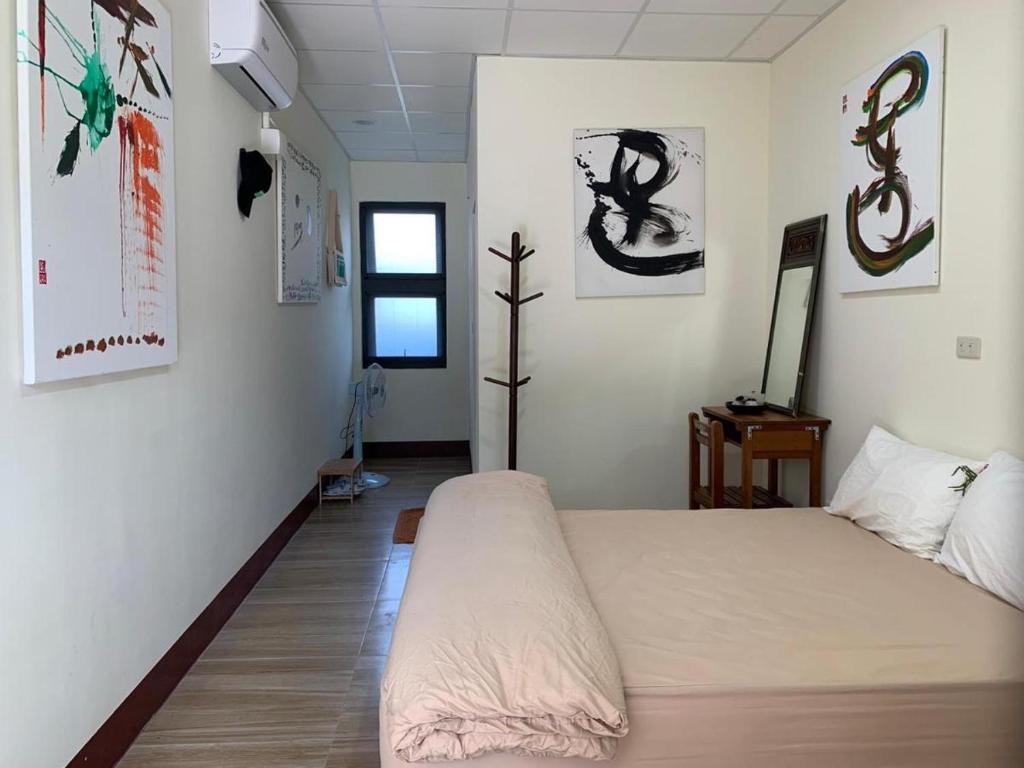 Postel nebo postele na pokoji v ubytování People Hostel Taiwan Image Calligraphy Museum
