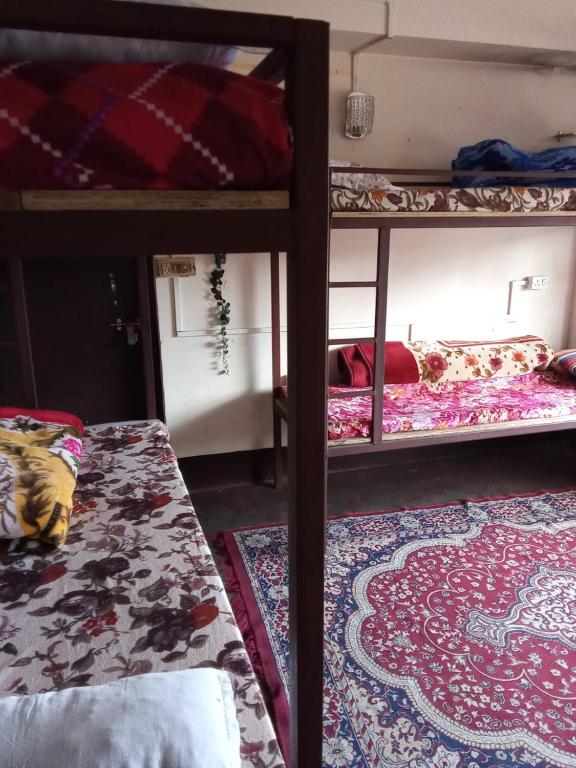 Postel nebo postele na pokoji v ubytování Backpackers Hostel