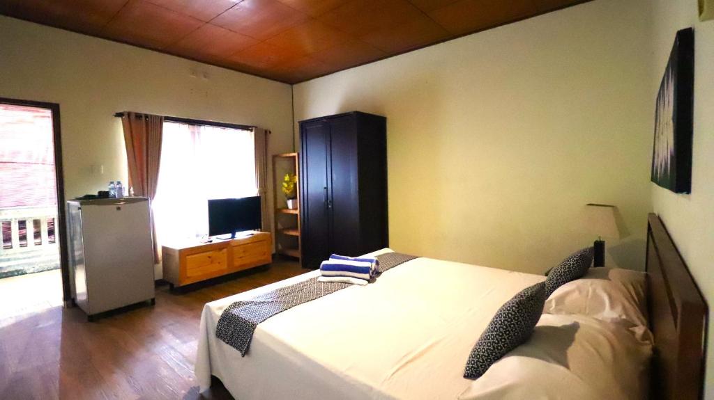 Postel nebo postele na pokoji v ubytování Villa Happy Jimbaran