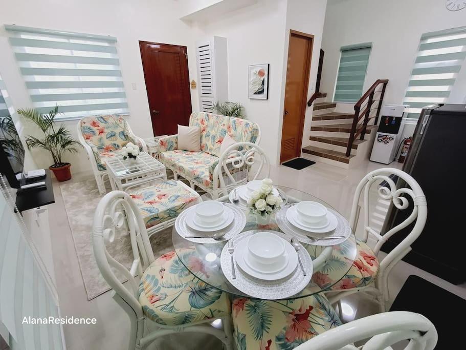 a dining room with a table and chairs at Vacation Home near Panglao Airport and White Sand Beaches in Biking