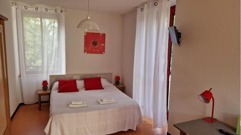 Postel nebo postele na pokoji v ubytování Résidence du Rougier