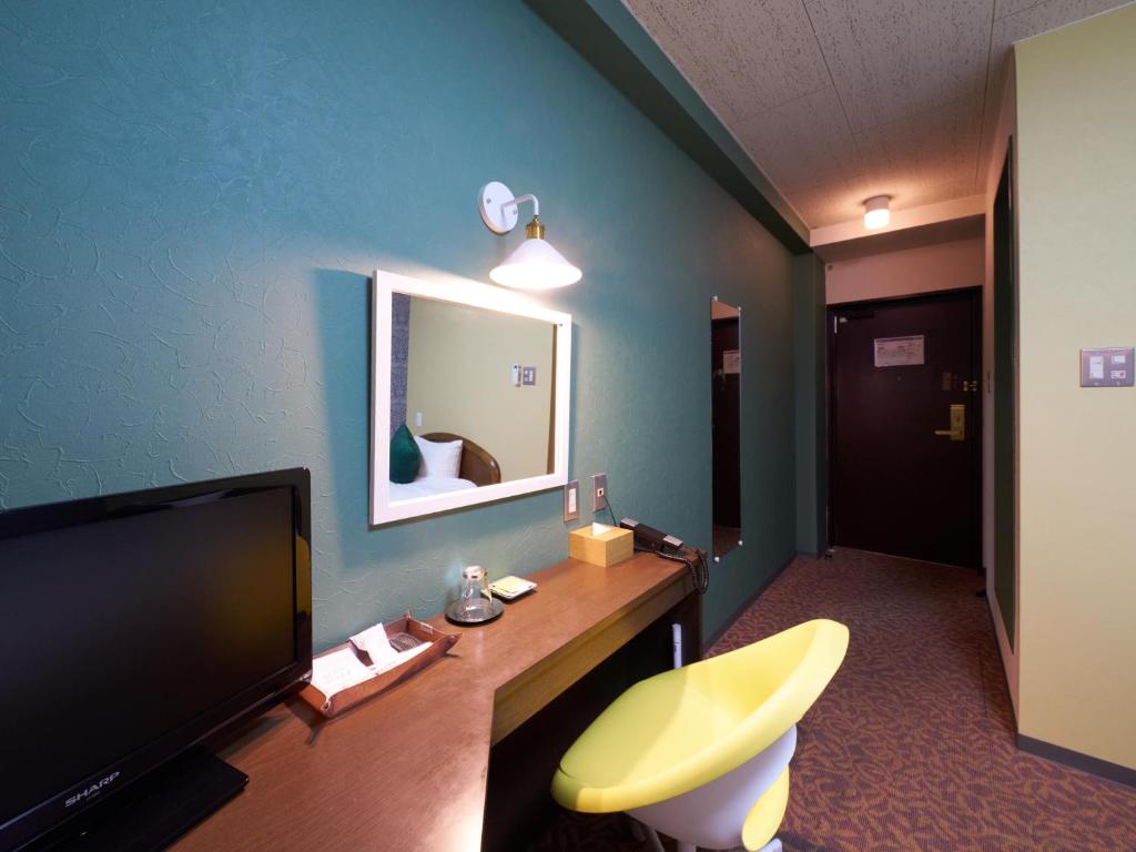 TV a/nebo společenská místnost v ubytování Hotel Village