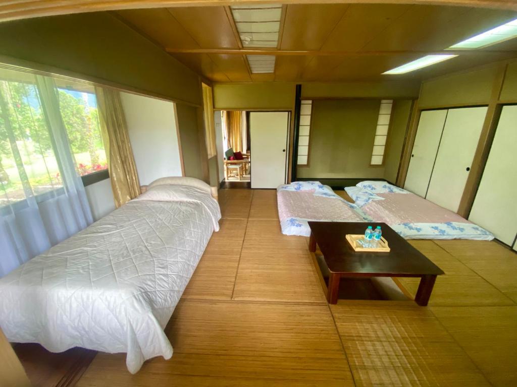 Postel nebo postele na pokoji v ubytování The Buyan Resort Bedugul