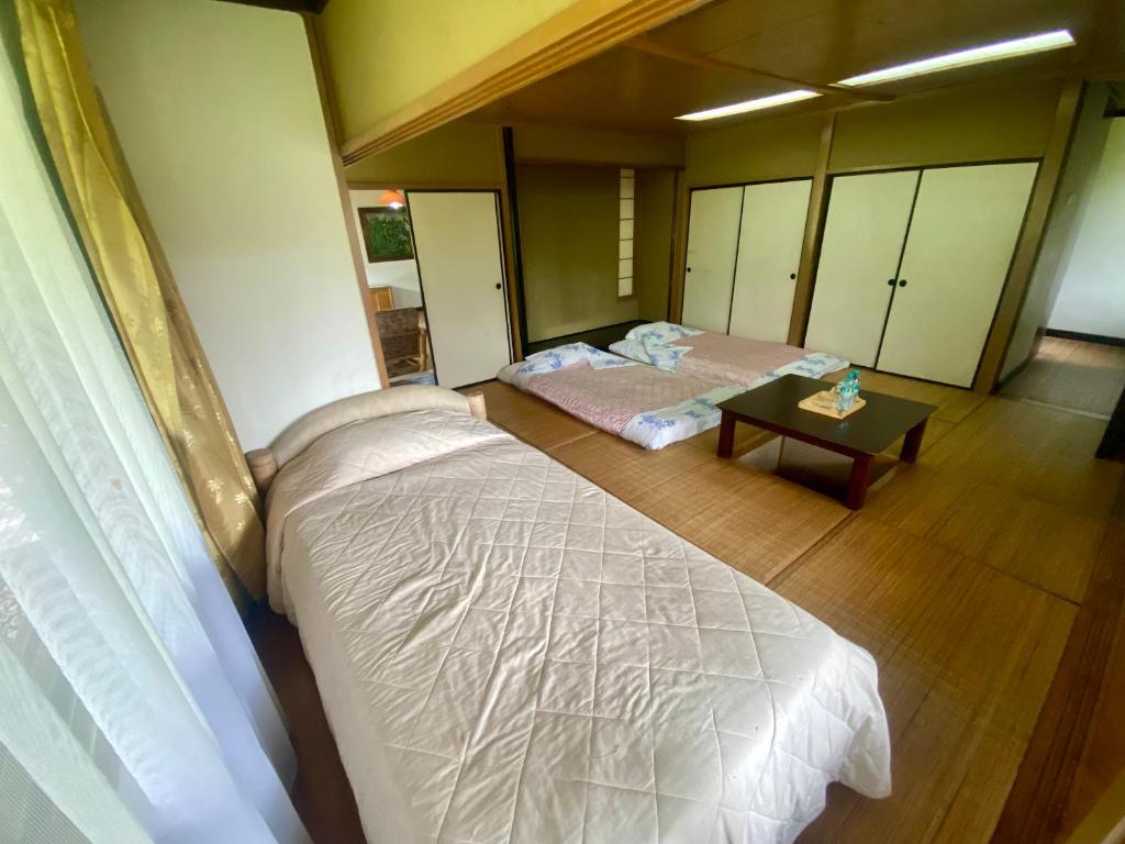 Postel nebo postele na pokoji v ubytování The Buyan Resort Bedugul