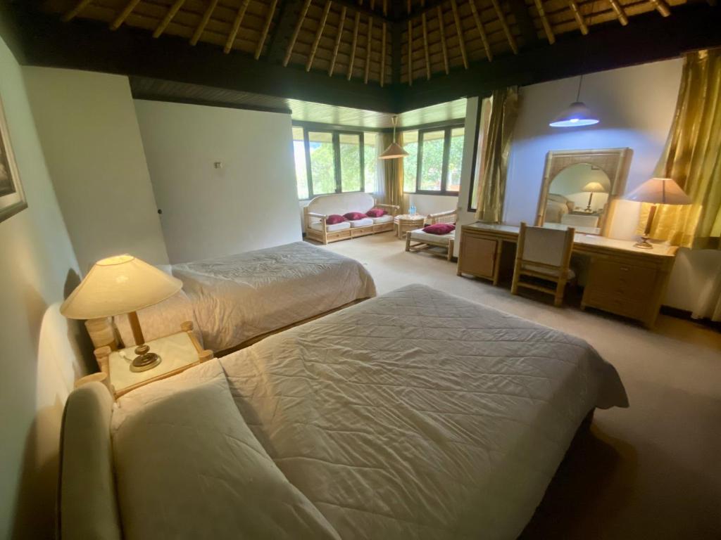 Postel nebo postele na pokoji v ubytování The Buyan Resort Bedugul