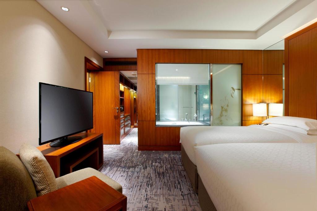 Postel nebo postele na pokoji v ubytování Sheraton Grand Taipei Hotel