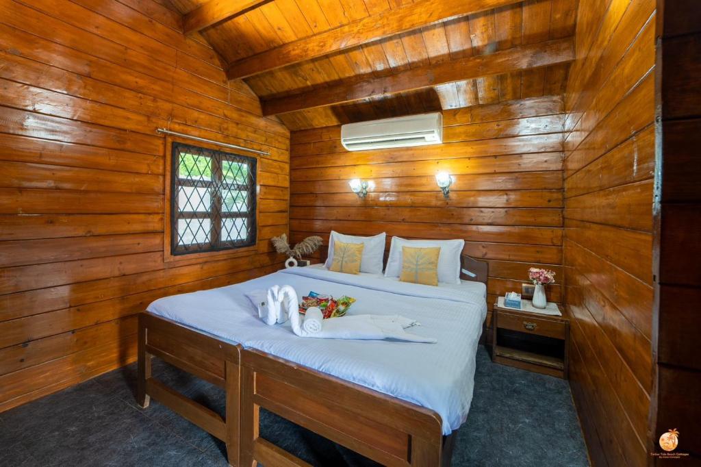 Voodi või voodid majutusasutuse TT Beach Cottages toas