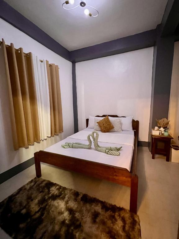Postel nebo postele na pokoji v ubytování Eighty8 Tourist Inn