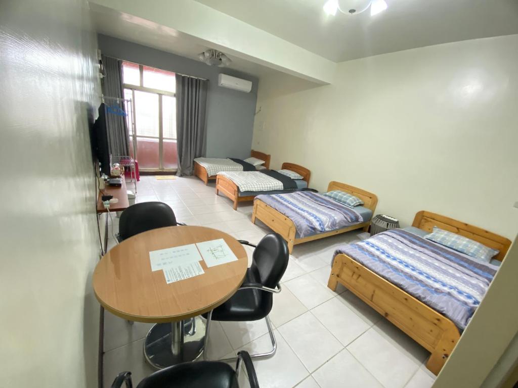 Postel nebo postele na pokoji v ubytování 彰濱伸港民宿