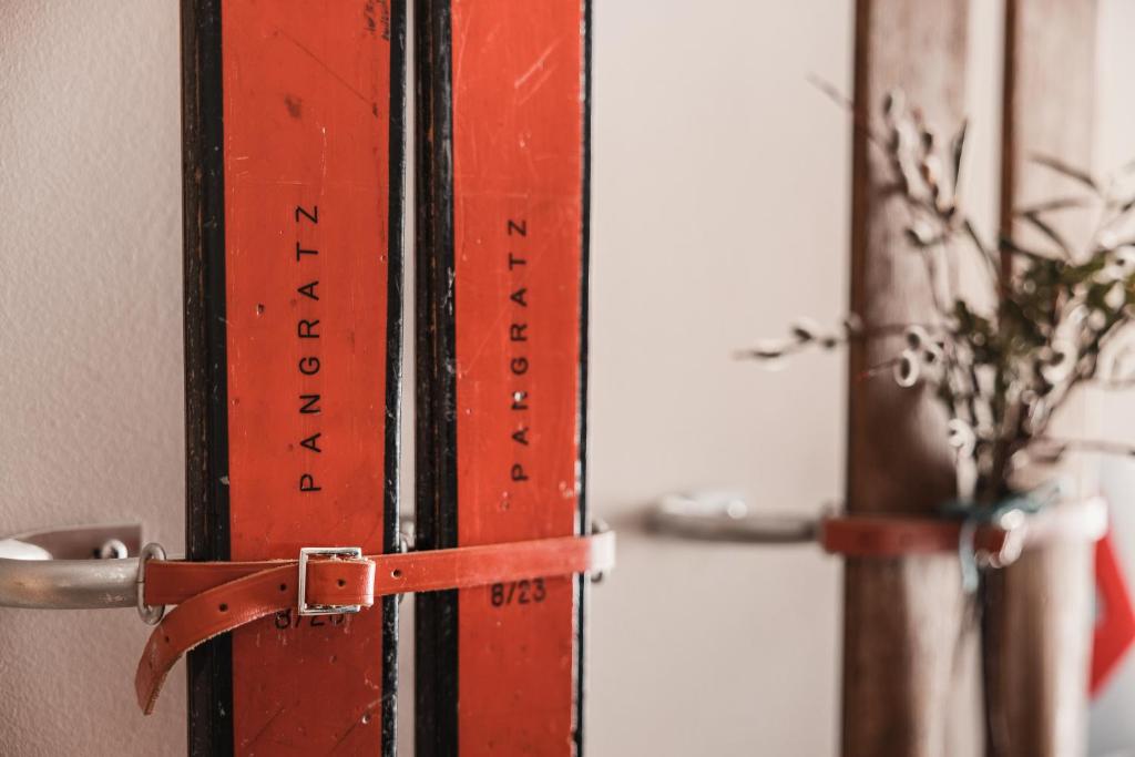 a red door with a ruler on it at Anthony's Life&Style Hotel in Sankt Anton am Arlberg