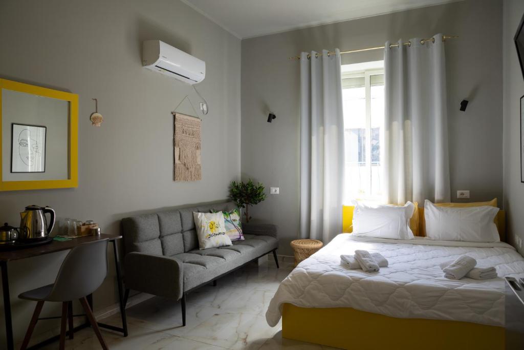 Postel nebo postele na pokoji v ubytování Jonian Boutique Hotel