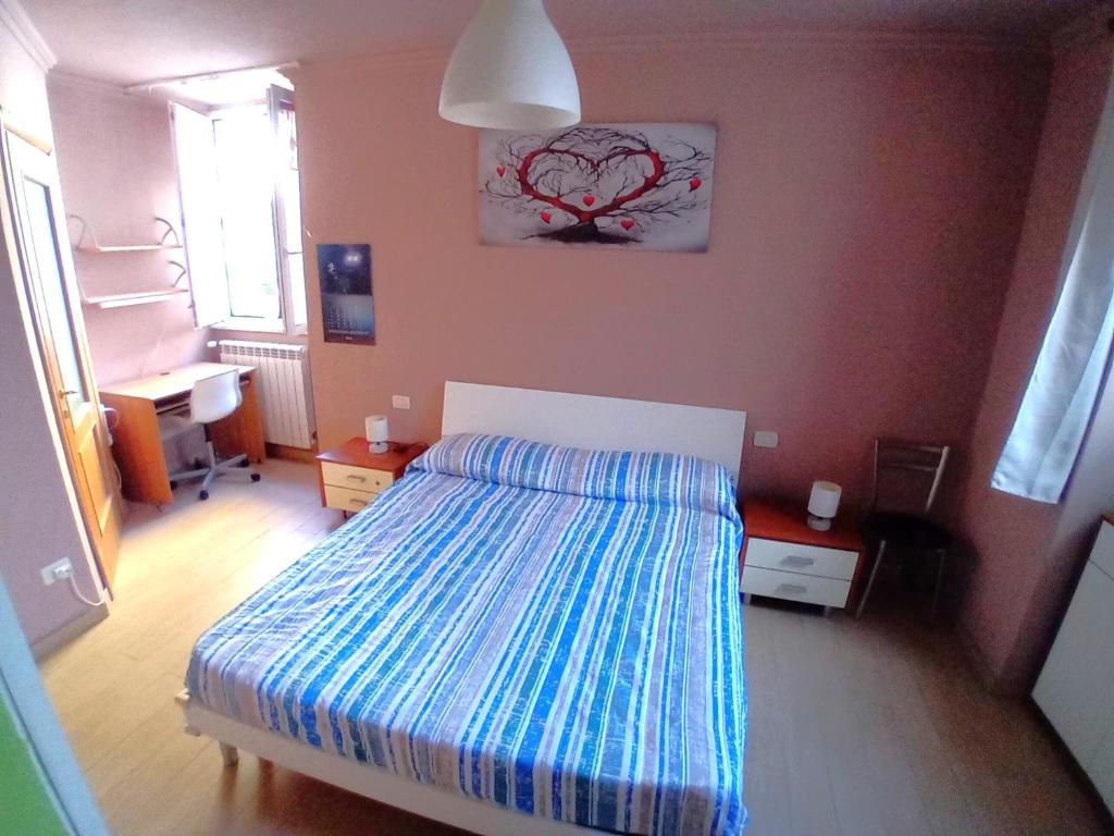 Postel nebo postele na pokoji v ubytování Le Perle di Alessia