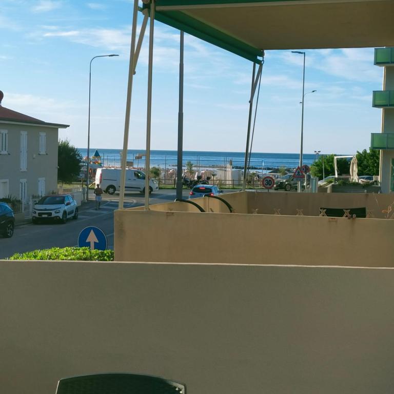 a view of the beach from the roof of a house at Appartamento AZZURRO in Pesaro