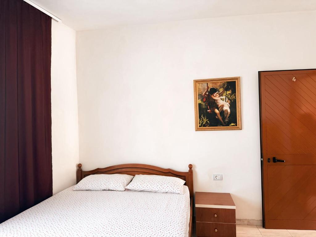 Postel nebo postele na pokoji v ubytování Ibras House