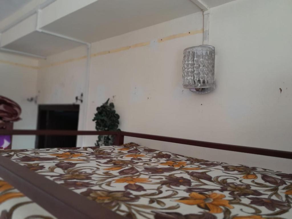Postel nebo postele na pokoji v ubytování Backpackers Hostel
