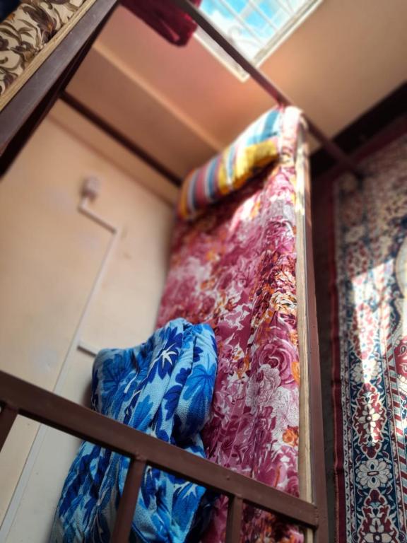 Postel nebo postele na pokoji v ubytování Backpackers Hostel