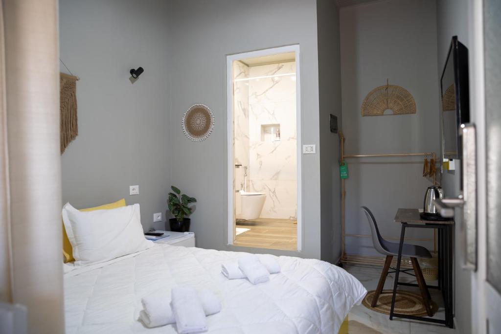 Postel nebo postele na pokoji v ubytování Jonian Boutique Hotel
