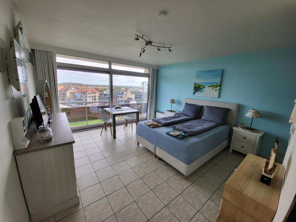 Postel nebo postele na pokoji v ubytování Studio with sea view and panoramic view in Bredene