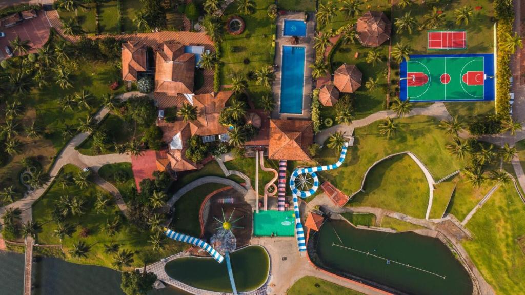 an aerial view of a resort with a swimming pool at Tinton Adventure Resort in Golikatte