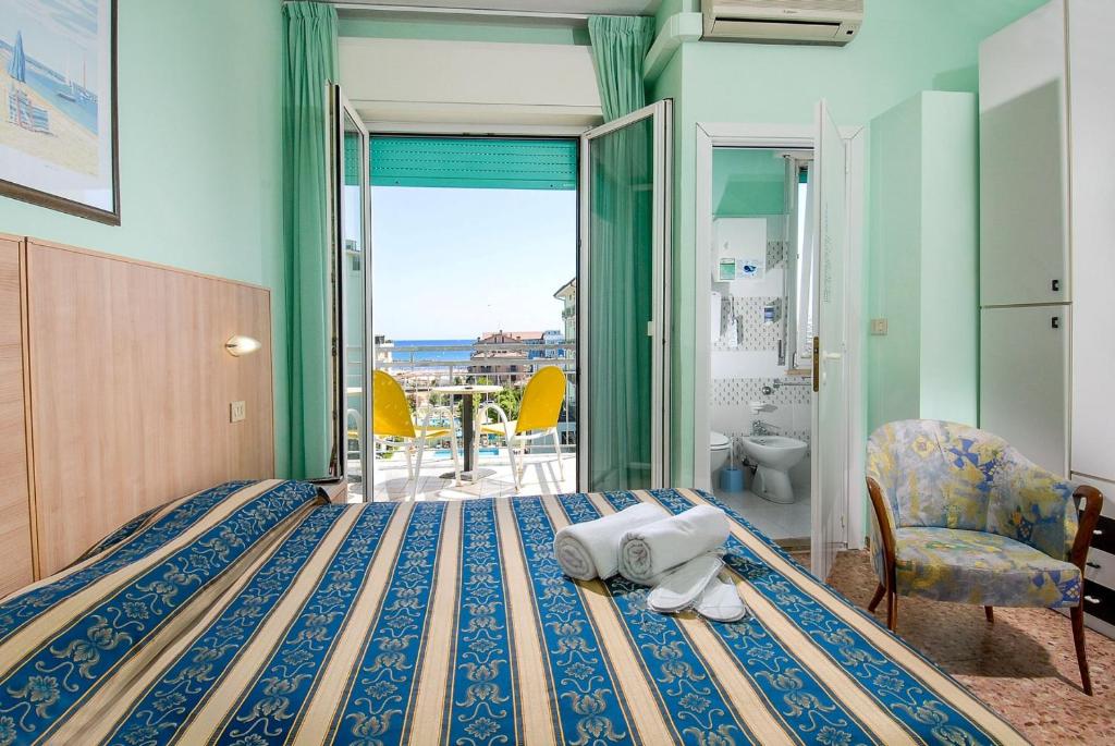 Postel nebo postele na pokoji v ubytování Hotel Bahamas