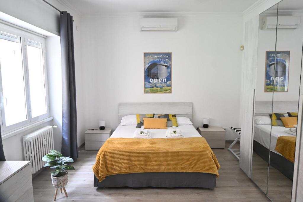 A bed or beds in a room at Appia Antica Guest House