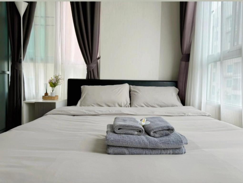 Postel nebo postele na pokoji v ubytování D condo