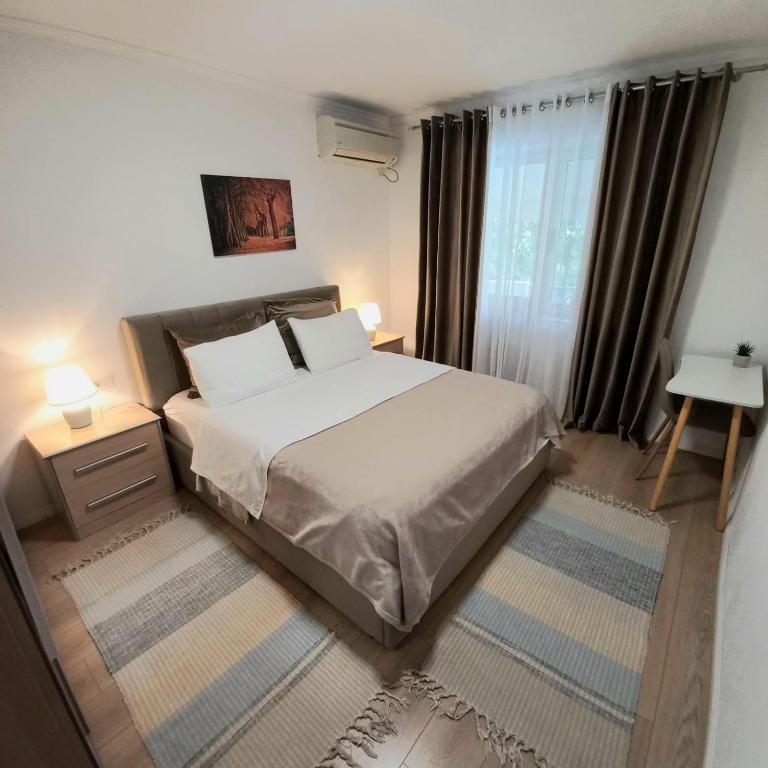 Postel nebo postele na pokoji v ubytování Regis Apartment