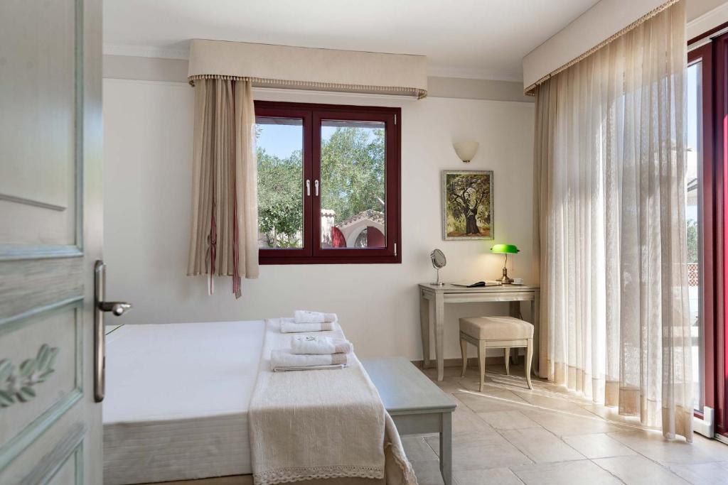 Postel nebo postele na pokoji v ubytování Triena Villas by PaxosRetreats