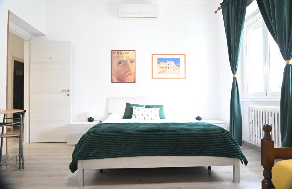 A bed or beds in a room at Appia Antica Guest House