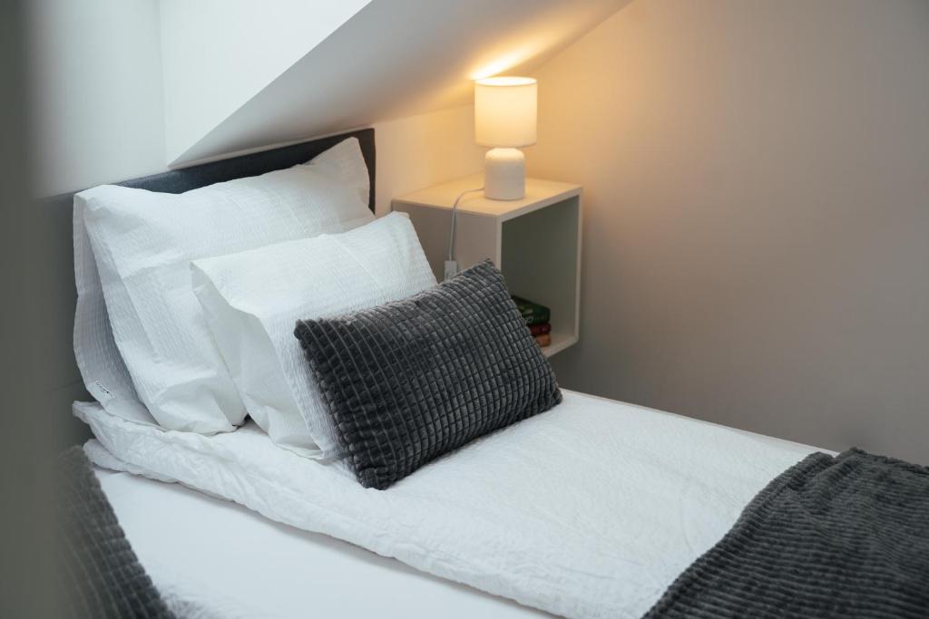 Postel nebo postele na pokoji v ubytování H30 Apartman