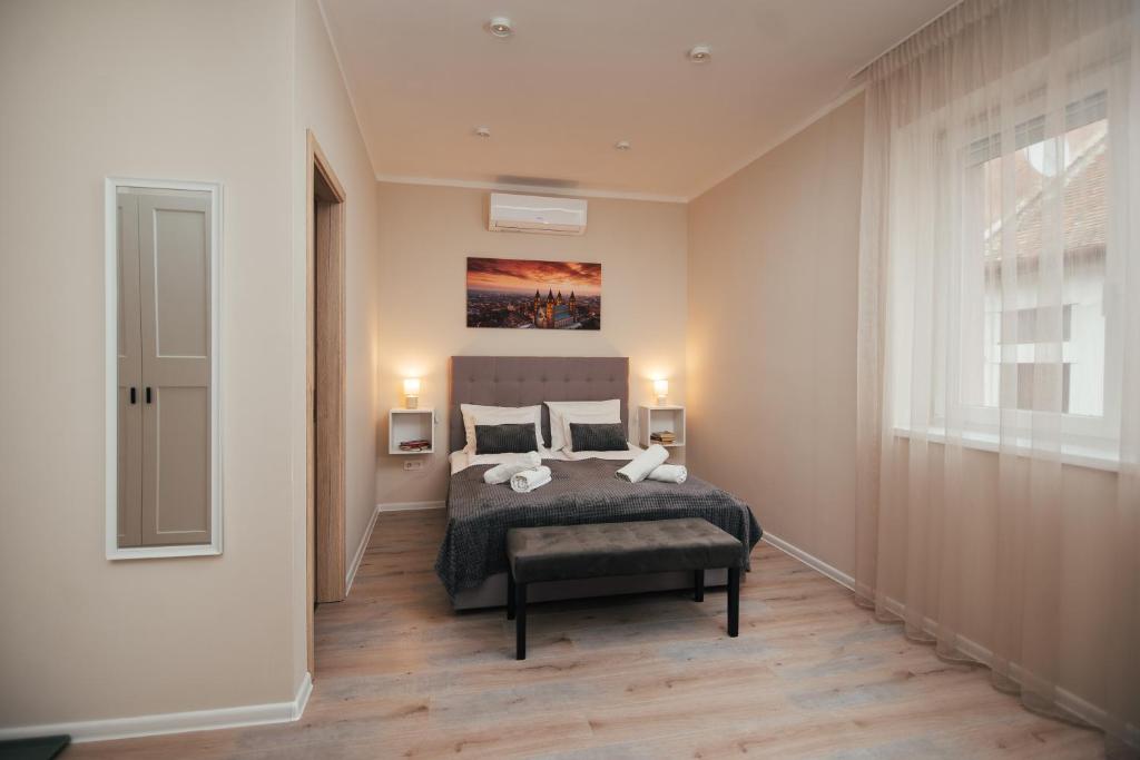 Postel nebo postele na pokoji v ubytování H30 Apartman