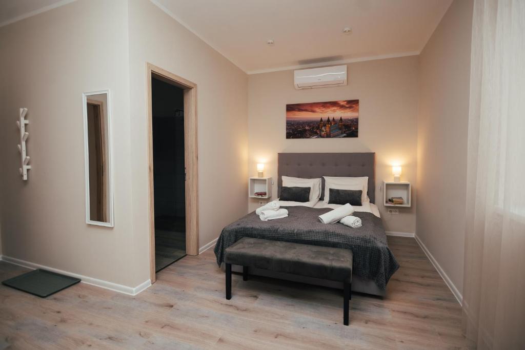 Postel nebo postele na pokoji v ubytování H30 Apartman