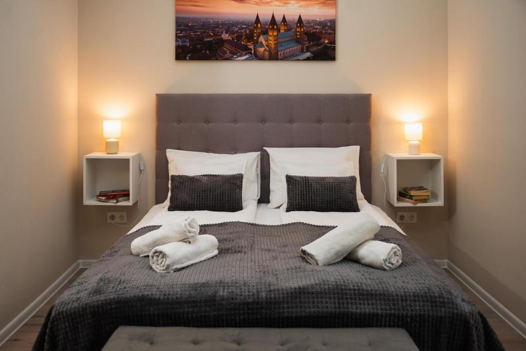 Postel nebo postele na pokoji v ubytování H30 Apartman