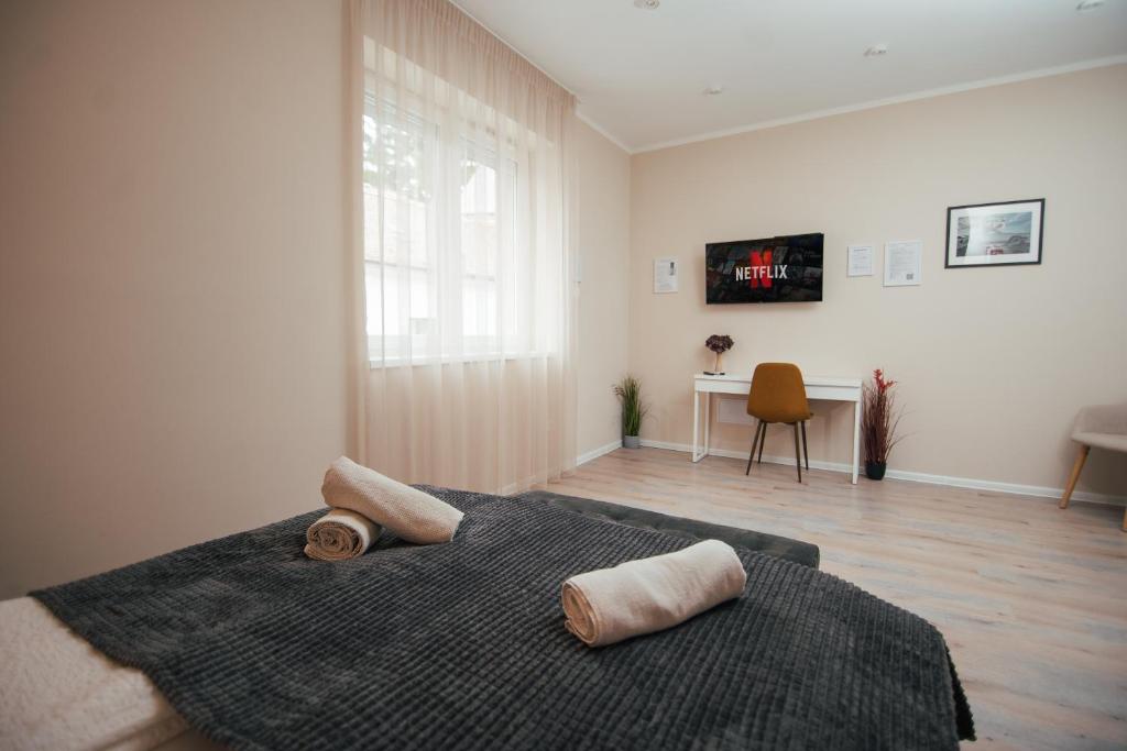 Postel nebo postele na pokoji v ubytování H30 Apartman
