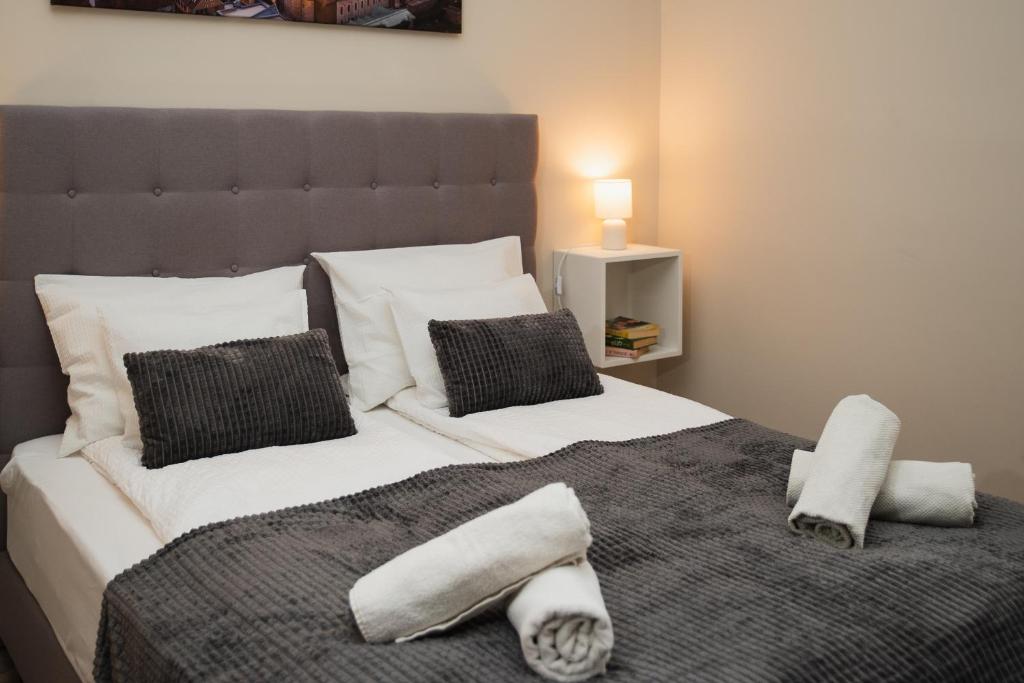 Postel nebo postele na pokoji v ubytování H30 Apartman