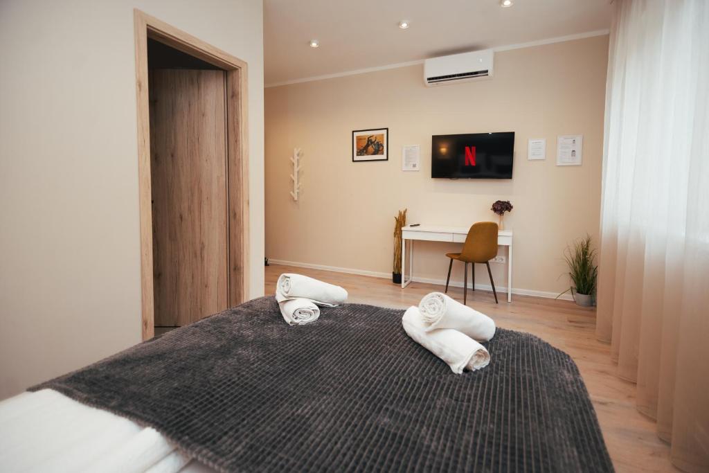 Postel nebo postele na pokoji v ubytování H30 Apartman
