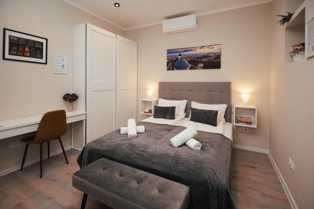 Postel nebo postele na pokoji v ubytování H30 Apartman