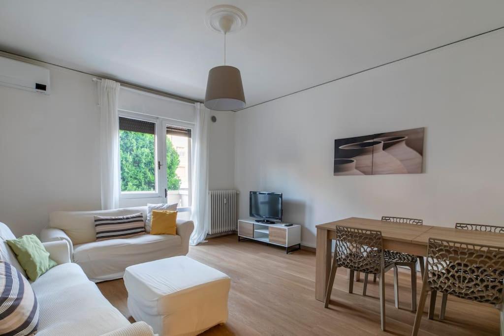 a living room with a couch and a table at i-HOMES Family Comfort Padova in Padova