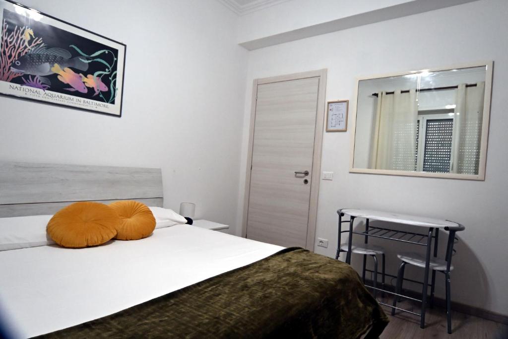 A bed or beds in a room at Appia Antica Guest House