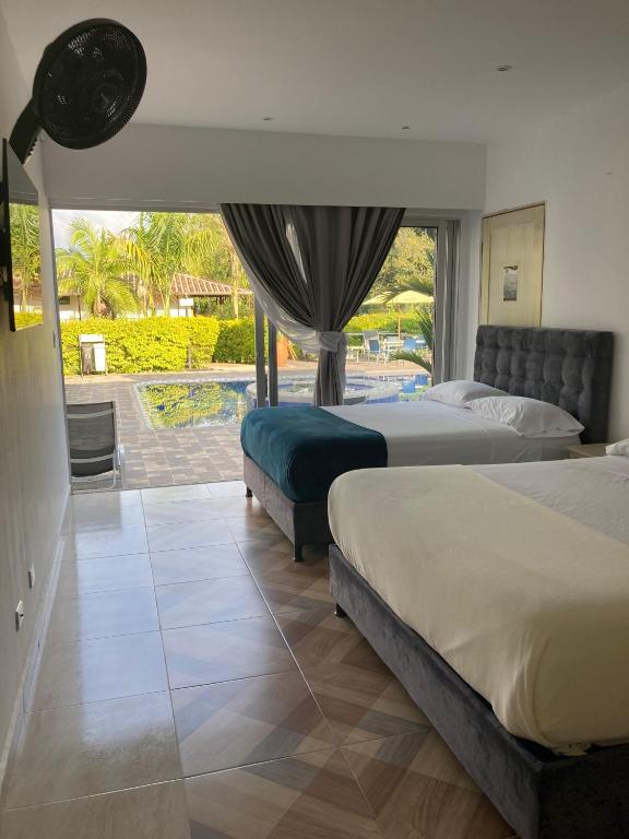 Postel nebo postele na pokoji v ubytování Villa Thiago Finca