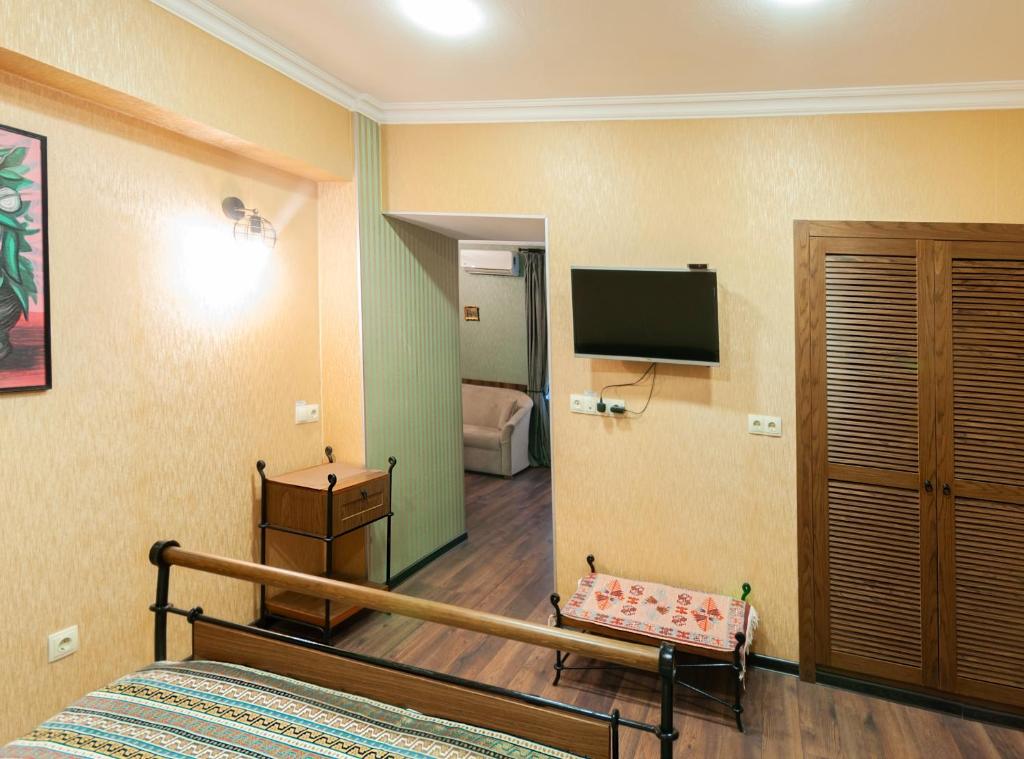 TV a/nebo společenská místnost v ubytování Wine Story Hotel & Club