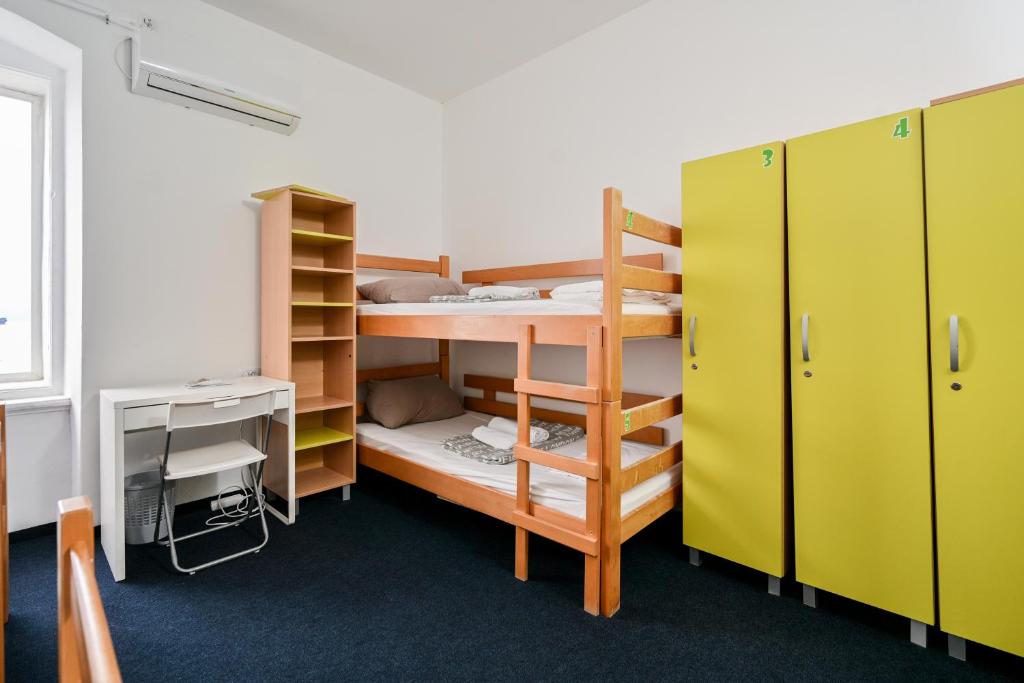 Postel nebo postele na pokoji v ubytování Hostel Fun