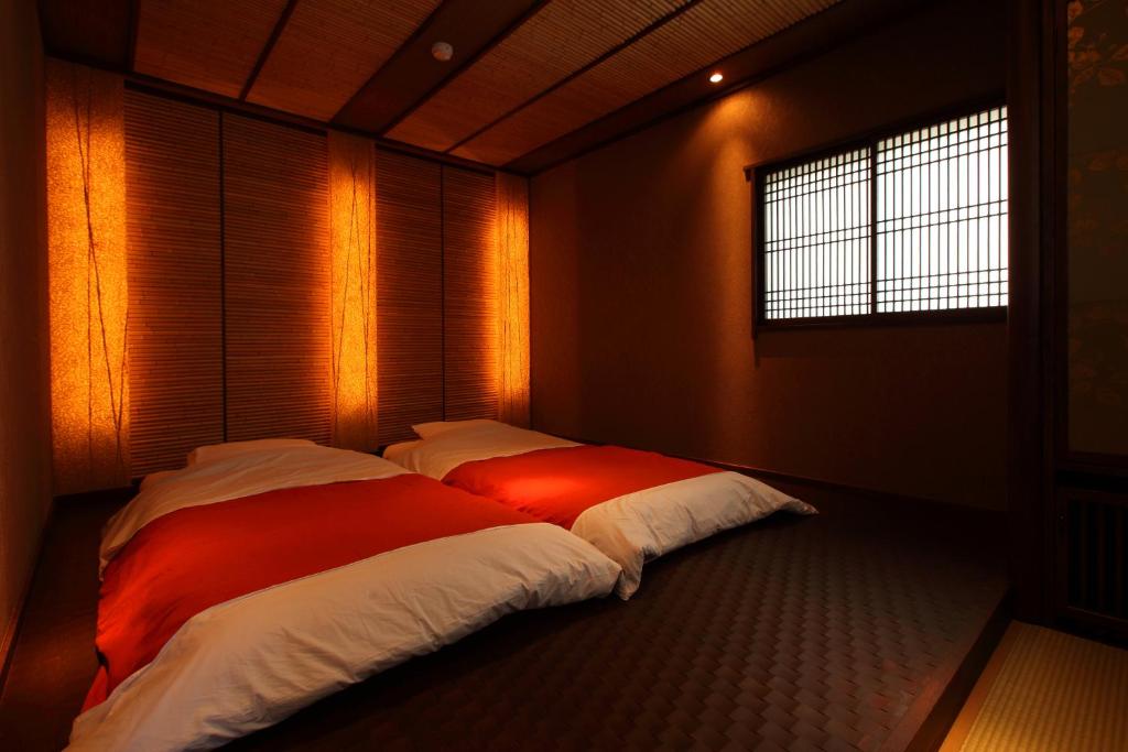 Postel nebo postele na pokoji v ubytování Hakone Onsen Ryokan Yaeikan