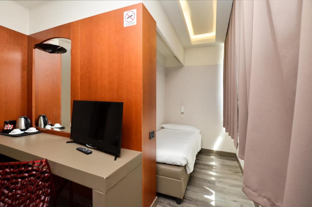 TV a/nebo společenská místnost v ubytování The Gate Hotel