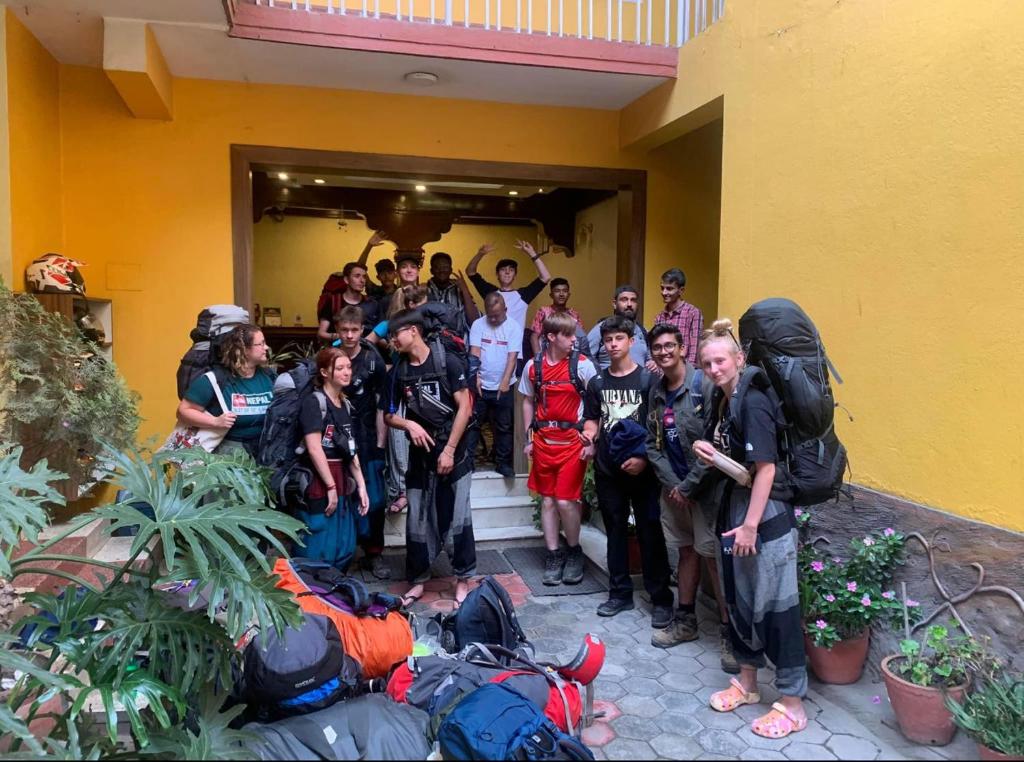 a group of people posing for a picture outside a building at Buddha Home Nepal in Thapathali