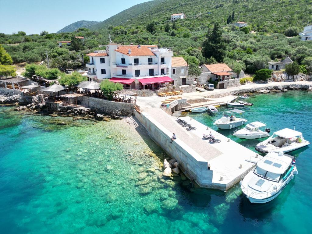 an aerial view of a resort with boats in the water at Hotel Timun in Gdinj