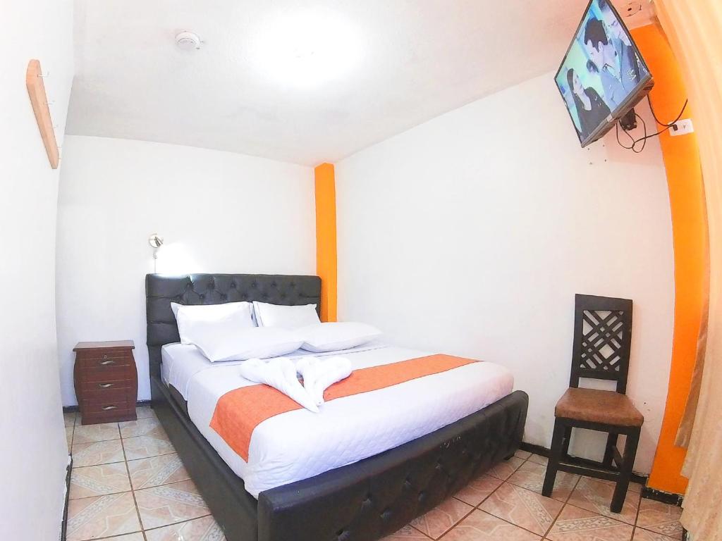 Postel nebo postele na pokoji v ubytování Hostal Anais