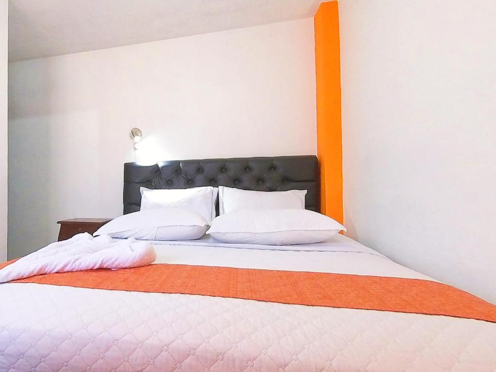 Postel nebo postele na pokoji v ubytování Hostal Anais