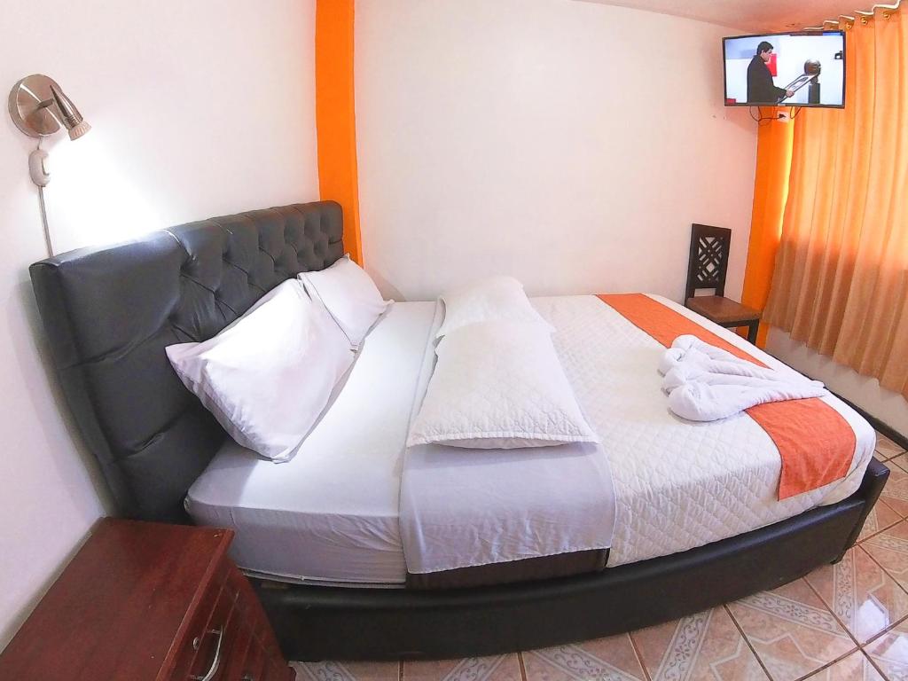 Postel nebo postele na pokoji v ubytování Hostal Anais